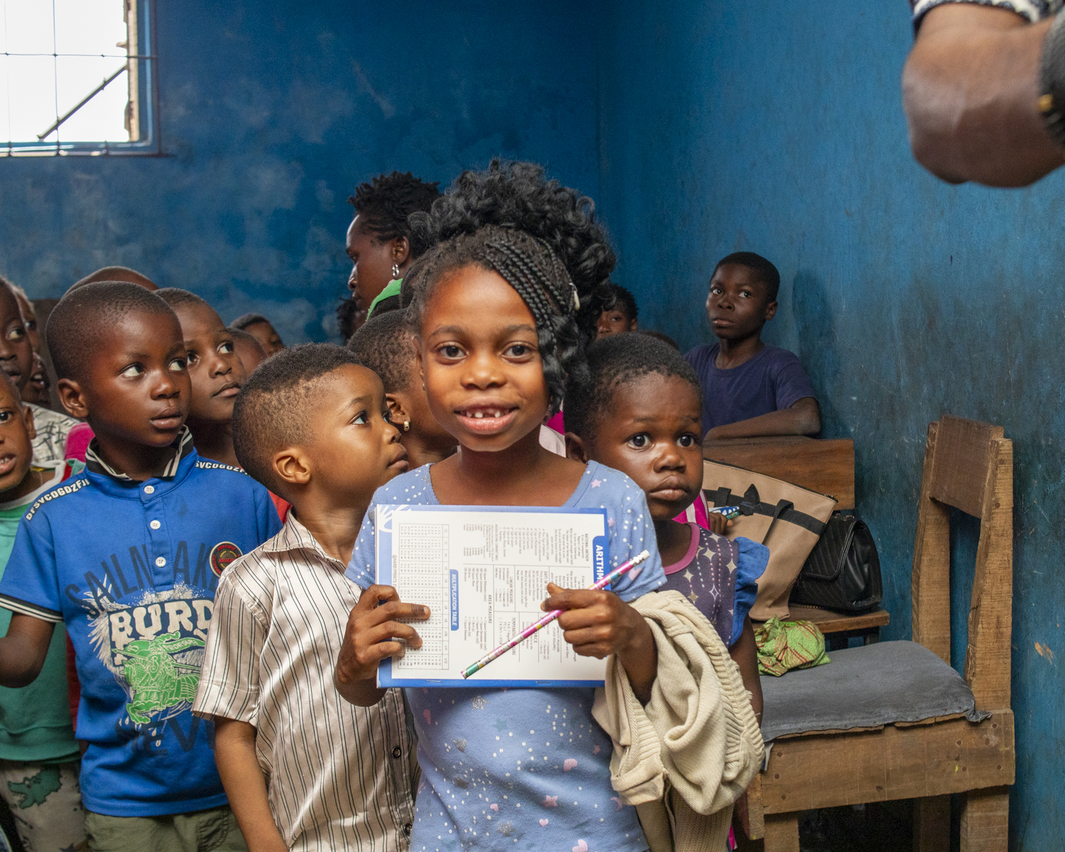 Student with notepad and pen at Summer School